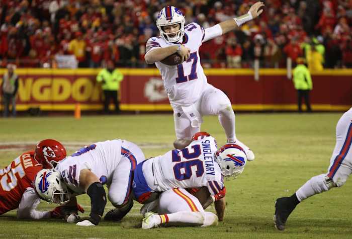 Buffalo Bills quarterback Josh Allen hurdles over players in the AFC Divisional Round against the Kansas City Chiefs at Arrowhead Stadium on Jan. 24, 2022. Syndication Democrat And Chronicle